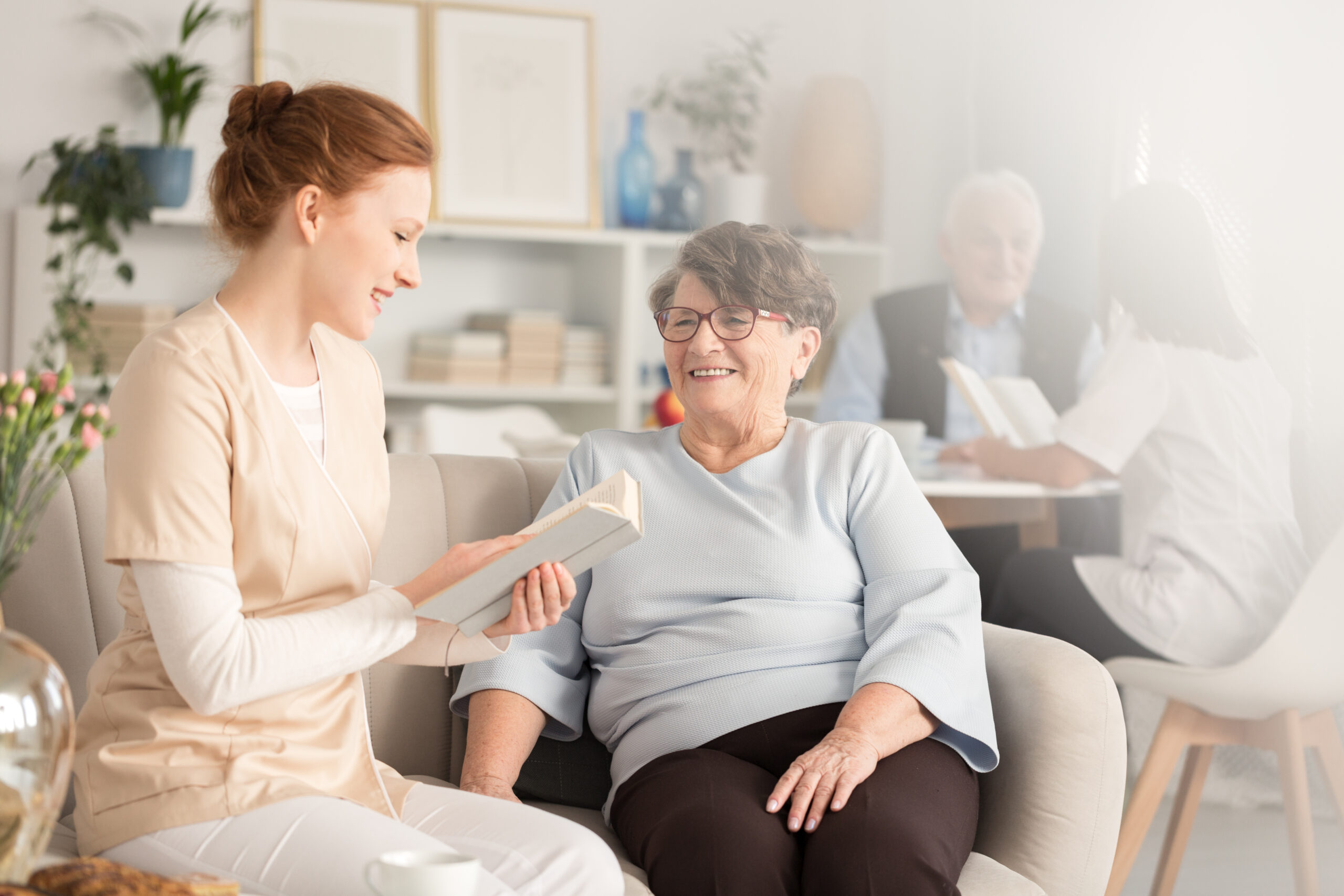 Caregiver providing medication management at home in Palm Beach FL for a senior with prescriptions and pill organizer